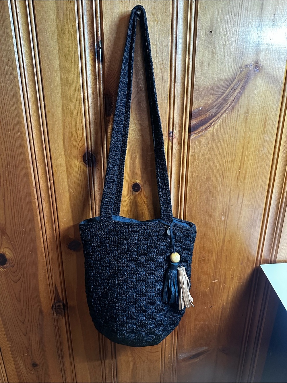 The Sak Black Crochet Crossbody with Tassel Accent